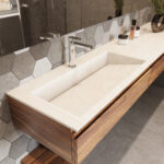 Solid surface bathroom vanity top with right-side integrated sink and minimalist design